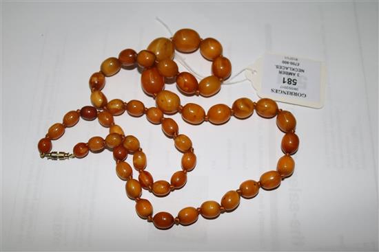 Three assorted amber necklaces, gross weight 108 grams.